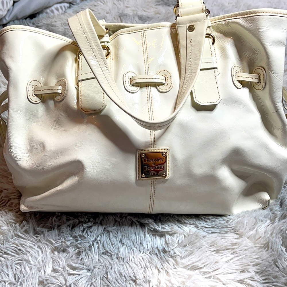 Dooney and Bourke off White leather Larger  bag.